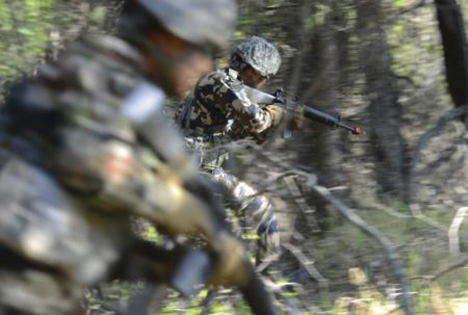 Nepalese army rangers rush into an ambush during the Situational Training Exercise portion of the U.S. Army Alaska Warrior Leader Course with U.S. Army Soldiers and U.S. Air Force Airmen on Joint Base Elmendorf-Richardson. (Photo by Justin Connaher)