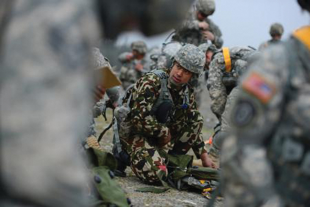 A Nepalese soldier prepares for the land navigation portion of the U.S. Army Alaska Warrior Leader Course on Joint Base Elmendorf-Richardson. (Photo by Justin Connaher)