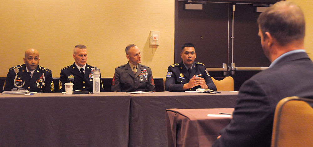 Former Sgt. Maj. of the Army Kenneth O. Preston, right, listens to the senior enlisted panel. Pictured in the panel are, from left, Command Sgt. Maj. James Norman, command sergeant major of U.S. Army 1st Corps; Command Sgt. Maj. John Troxell, command sergeant major of U.S. Forces Korea; Sgt. Maj. William Stables, sergeant major of U.S. Marine Corps Forces Pacific; and Lead Sgt. Daribish Oyunbold, senior enlisted advisor of the Mongolian Armed Forces.