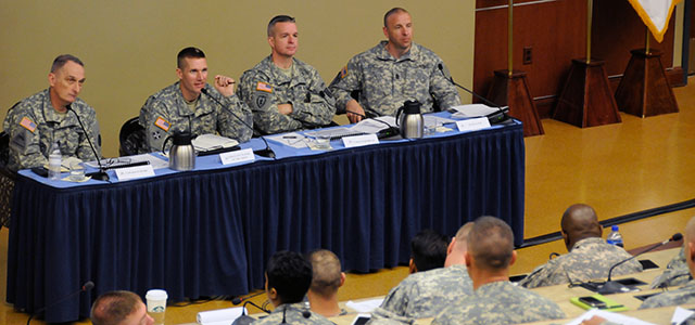From left, Command Sgt. Maj. David S. Davenport Sr., command sergeant major of the U.S. Army Training and Doctrine Command; Sgt. Maj. of the Army Daniel A. Dailey; Command Sgt. Maj. David O. Turnbull, command sergeant major of the Combined Arms Center; and Sgt. Maj. Dennis A. Eger, sergeant major of the Mission Command Center of Excellence, take part in discussions May 1 during the Outbrief session of the Noncommissioned Officer Solarium 2015 at Fort Leavenworth, Kan. The Solarium is an initiative of the sergeant major of the Army.