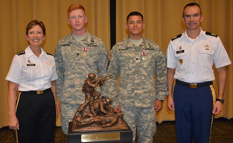 Lt. Gen. Patricia D. Horoho, from left, stands with Spc. Colin O’Donnell, Spc. Jesus Romero and Sgt. Maj. Gerald C. Ecker during an awards ceremony