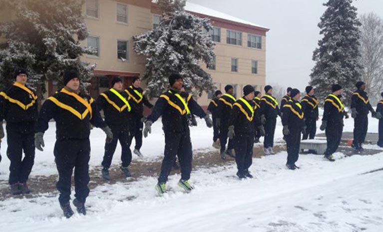 Sgt. 1st Class Brandon Myles speaks to the morning shift at Black Jack Inn Dining Facility at Fort Hood, Texas. 