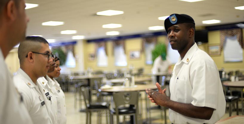 Sgt. 1st Class Brandon Myles speaks to the morning shift at Black Jack Inn Dining Facility at Fort Hood, Texas. 