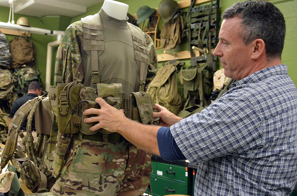 Rich Landry discusses the Airborne Tactical Assault Panel, which is an effort to design a fighting load chest rig compatible with the T-11 static line parachute harness. (Photos by Martha C. Koester / NCO Journal)