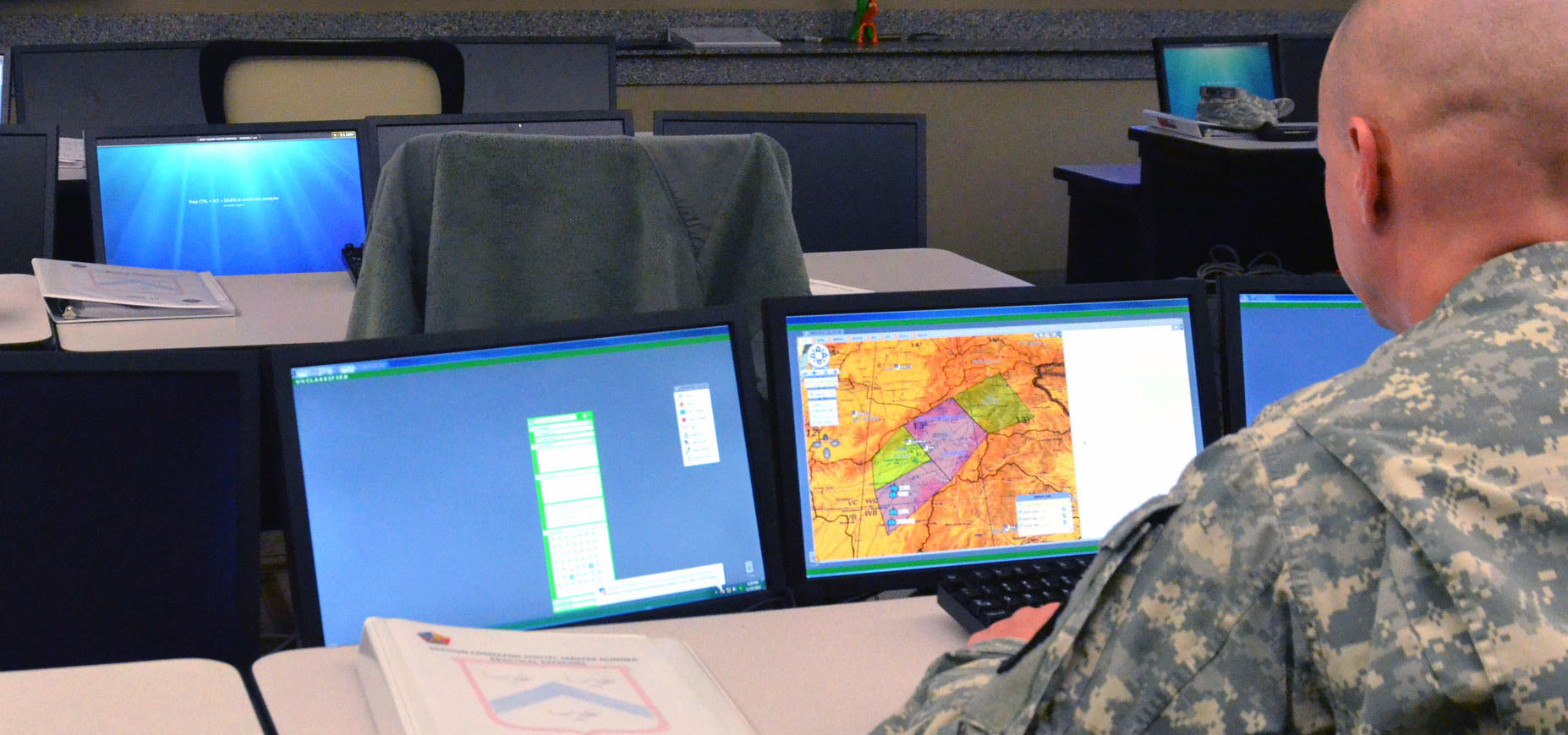 Staff Sgt. David Ennis, team lead observer-coach-trainer NCO in operations group X at the MCTP, works on a practical exercise scenario as part of the Mission Command Digital Master Gunner Course at Fort Leavenworth, Kan. “I’ve been on the line for nine years, so I’m learning a part of my job that I had no idea existed,” Ennis said. “Now that I’m in this class, you really see how much goes into the planning and preparation of a battlefield.” (Photo by Jonathan (Jay) Koester)