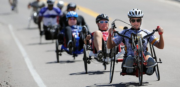 Line of cyclists racing.