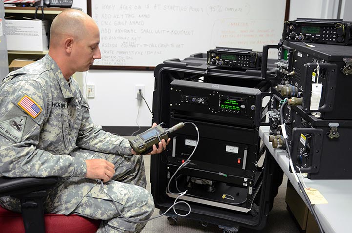 Staff Sgt. David A. Hoisington works at the Communications-Electronics Command, analyzing software data.