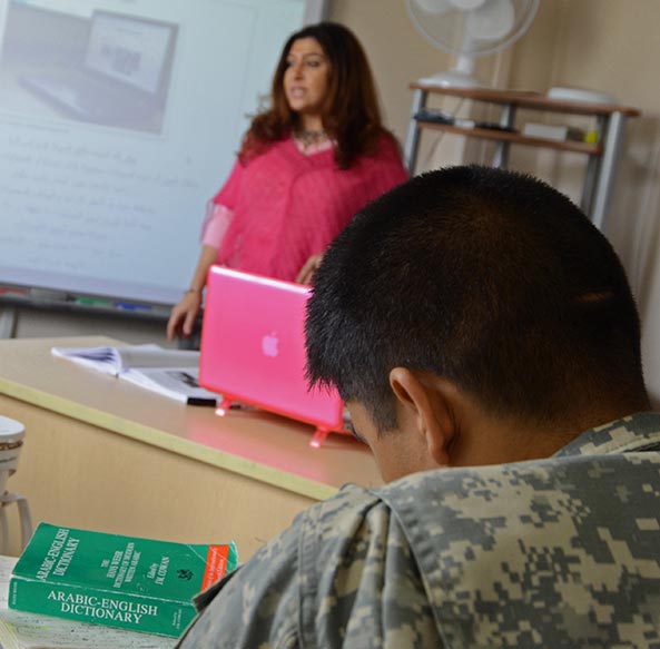A student listens to his professor during a Modern Standard Arabic (MSA) class at the Defense Language Institute Foreign Language Center.