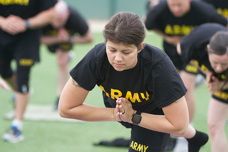 U.S. Army Spc. Tasha Kilen, Company B, Division Headquarters and Headquarters Battalion, 34th Red Bull Infantry Division, participates in a yoga class