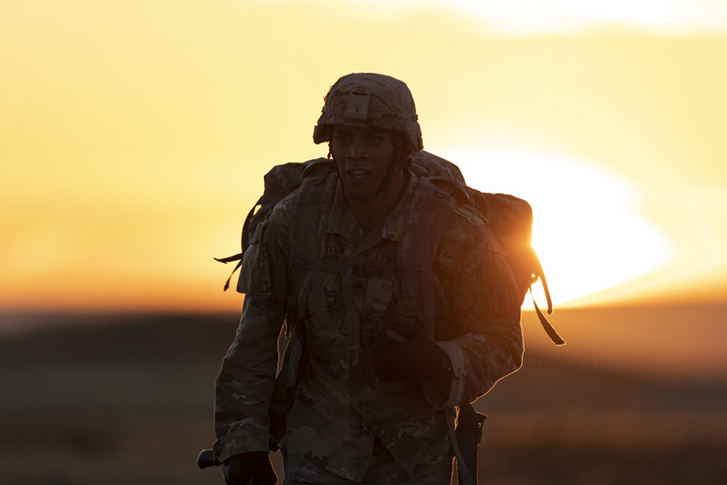 U.S. Army Sgt. Thomas Neenan, a military police Soldier assigned to 110th Military Police Company, 759th Military Police Battalion, 89th Military Police Brigade, approaches the midpoint of a 12-mile ruck march