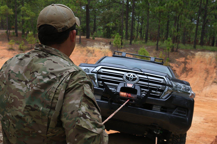 A Green Beret assigned to 3rd Special Forces Group (Airborne) instructs during an advanced skills company culminating exercise