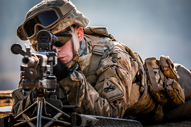 U.S. Army Sgt. James Balestrini positions himself in the prone to qualify on the M240B Machine Gun at Montana Range in South Korea