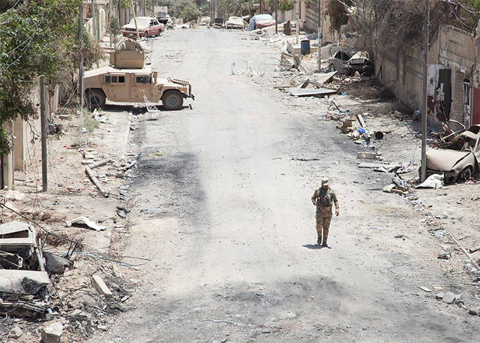 An Iraqi Security Forces member provides security near a patrol base in Mosul, Iraq, June 22, 2017. A global coalition of more than 60 regional and international nations have joined together to enable partner forces to defeat ISIS and restore stability and security. Combined Joint Task Force – Operation Inherent Resolve is the global coalition to defeat ISIS in Iraq and Syria.