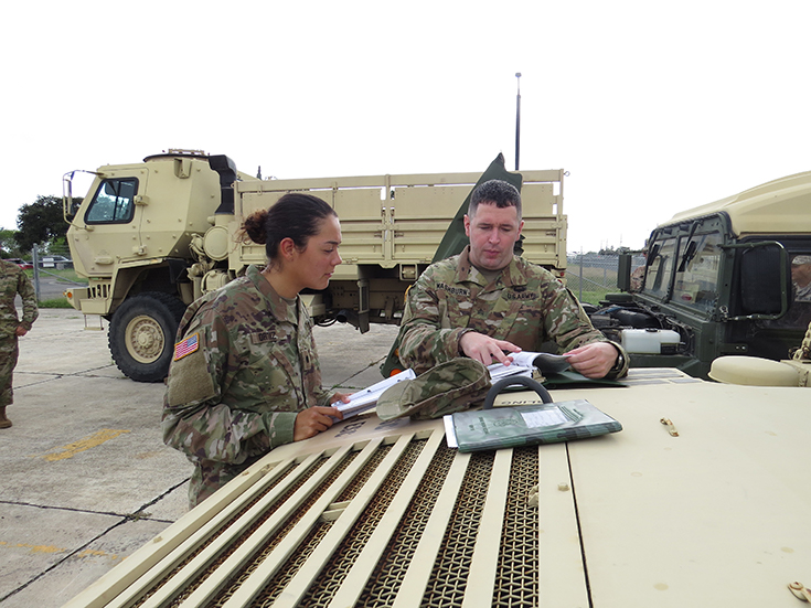 U.S Army Reserve Sgt. Richard Washburn shows Cadet Sheri Dyana Ortiz how to conduct a maintenance inspection on a M1097 Hight Mobility Multipurpose Vehicle