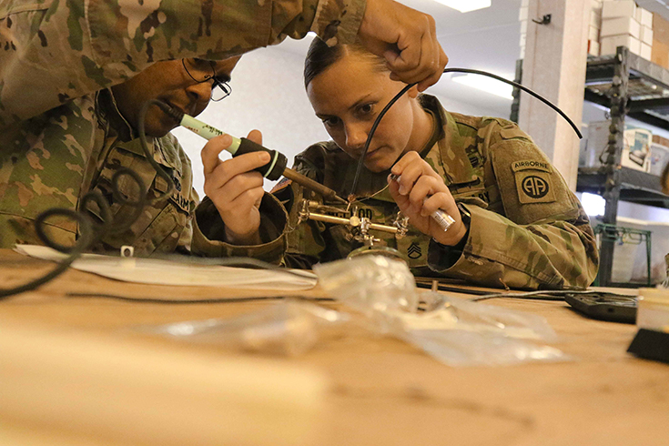 U.S. Army Staff Sgt. Luis Alicea and Staff Sgt. Ashley McLeod