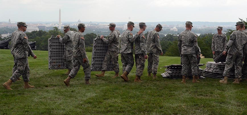 Soldiers of the 3rd Infantry Regiment (The Old Guard) set up for a Twilight Tattoo performance in June at Joint Base Myer-Henderson Hall, Arlington County, Virginia.