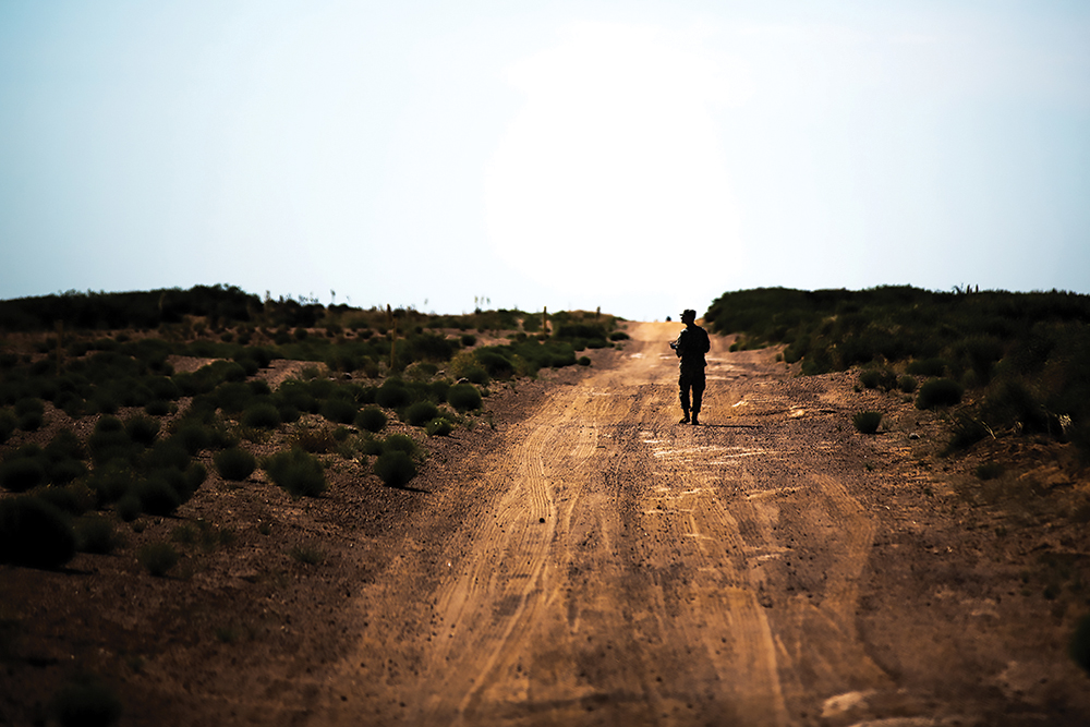 Sgt. Brendan Pinkham, assigned to Headquarters and Headquarters Company, 1st Battalion, 35th Infantry Regiment, 2nd Armored Brigade Combat Team, 1st Armored Division, finishes his last land navigation point June 5 during the new Desert Warrior course at Fort Bliss, Texas. (Photo by Sgt. Marcus Fichtl/U.S. Army)