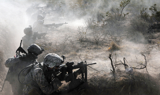 After successfully taking control of an enemy bunker, a squad of students in the Desert Warrior course defend their position during a live-fire exercise June 22 at Fort Bliss, Texas. (Photo by Staff Sgt. Marshall Mason/U.S. Army)