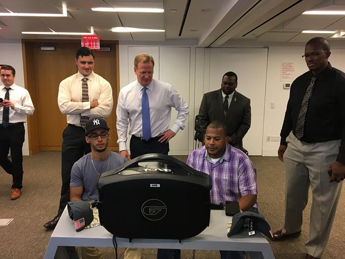 >NFL Commissioner Roger Goodell, center