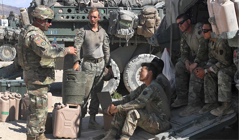 U.S. Army Command Sgt. Maj. Timothy Hileman, Pennsylvania National Guard, speaks with Soldiers of 1st Battalion, 111th Infantry Regiment, 56th Stryker Brigade Combat Team, 28th Infantry Division, Pennsylvania National Guard during their training rotation at the National Training Center, Fort Irwin, California, Aug. 13, 2018. (U.S. Army National Guard photo by Sgt. 1st Class HollyAnn Nicom)