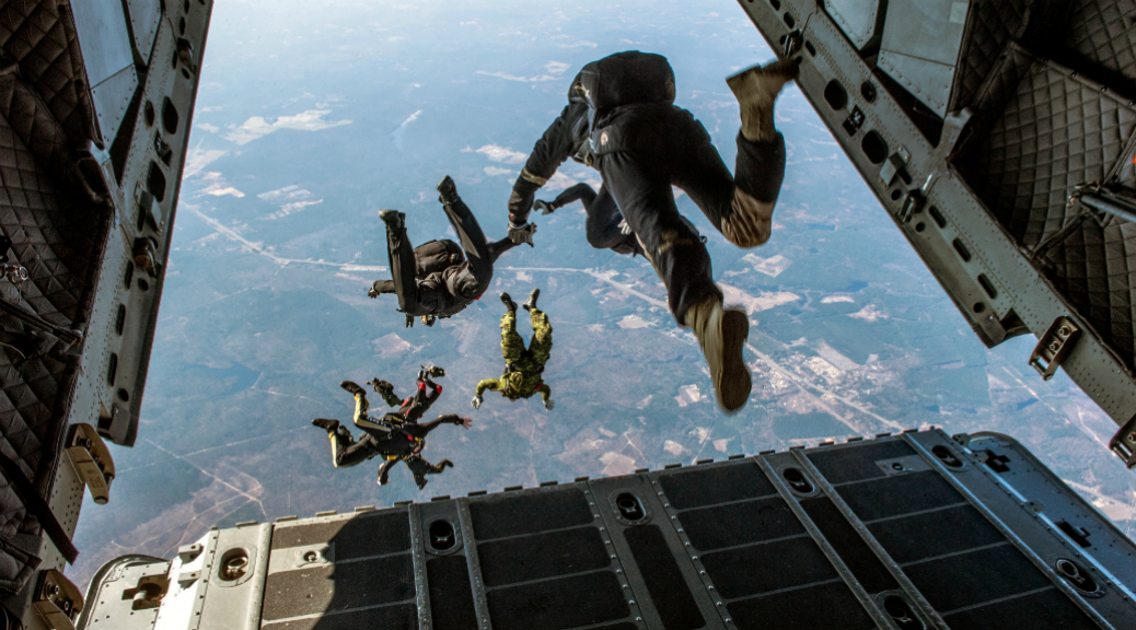 Members of the U.S. Army Parachute Team, the Black Knights, the U.S. Army Special Operations Command Parachute Team