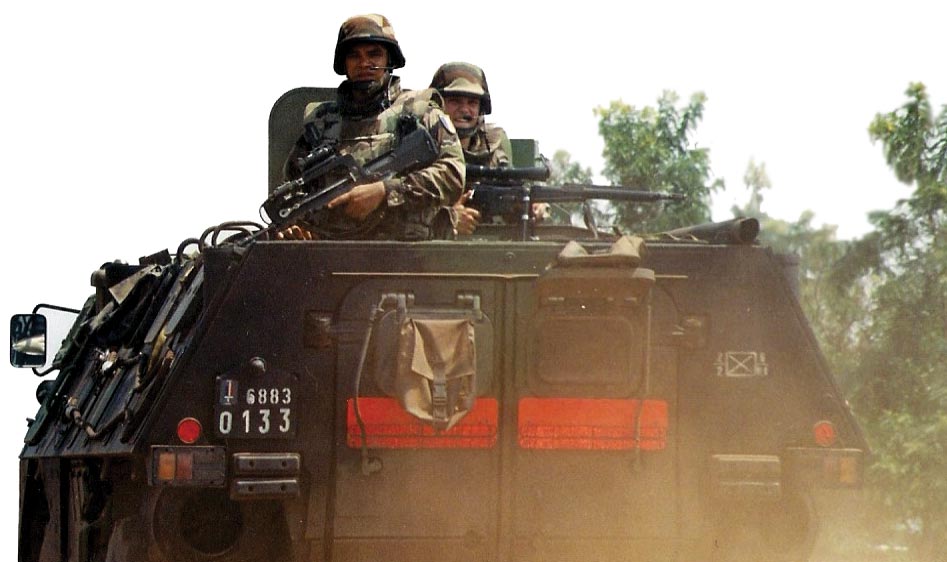 French soldiers ride in an armored personnel carrier April 2003 during Operation Licorne (Unicorn) in the Ivory Coast.
