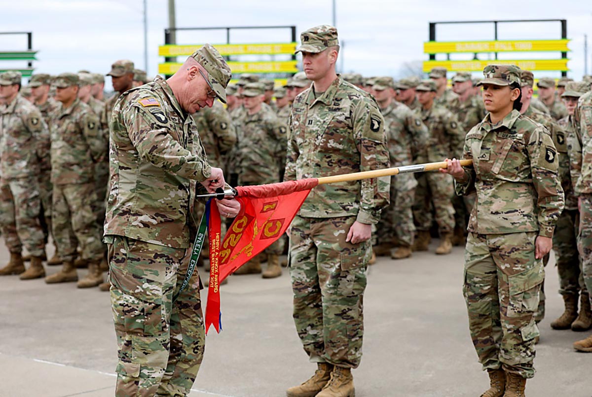 >Command Sgt. Maj. Thomas Conn, 2nd Brigade Combat Team, 101st Airborne Division (Air Assault) command sergeant major, presents a streamer to Battery C, 1st Battalion, 320th Field Artillery Regiment in Spring 2019 at Fort Campbell, Kentucky. 