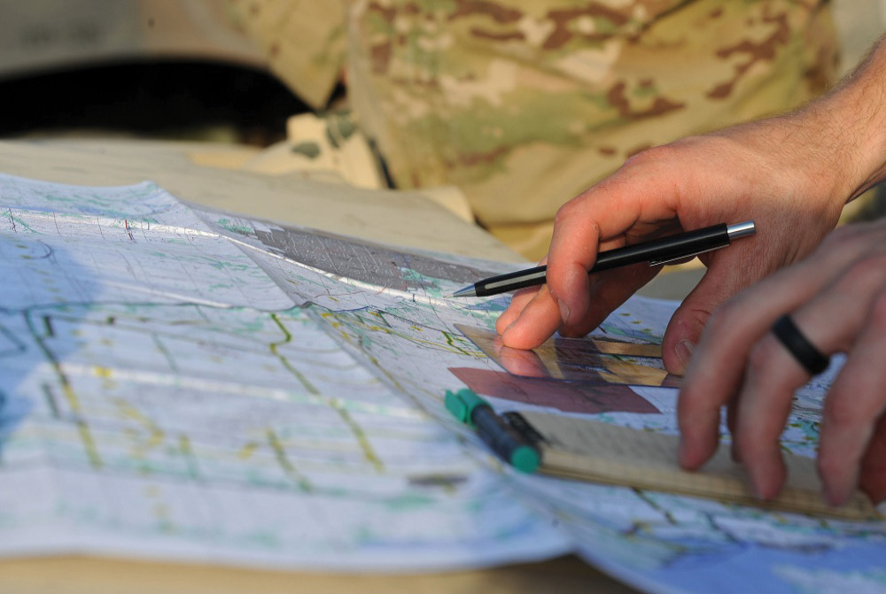 JTAC airmen reads a map