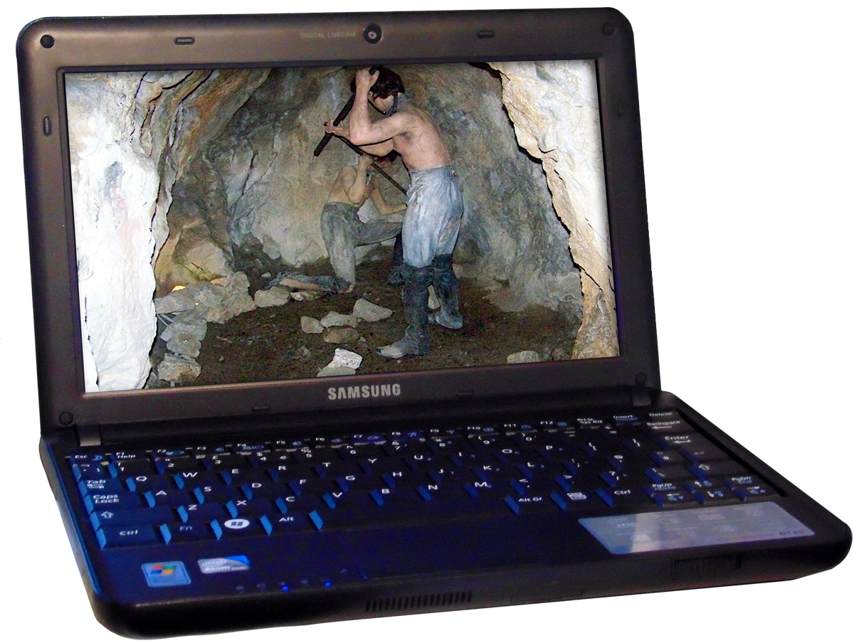 An open laptop computer with two people digging through a tunnel on the screen