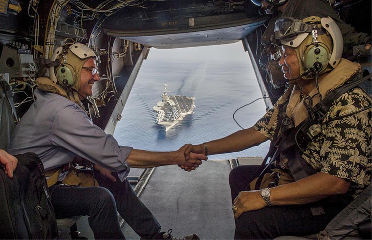 Secretary of Defense Ash Carter (left) and Philippine Secretary of National Defense Voltaire Gazmin shake hand