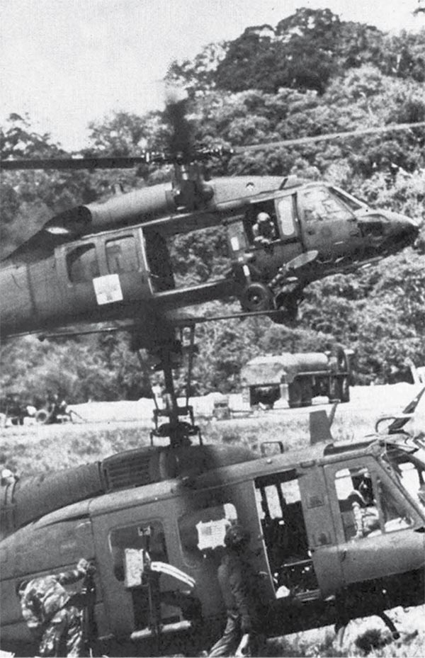 Blackhawk and Huey helicopters operating out of a supply point during Operation Just Cause.