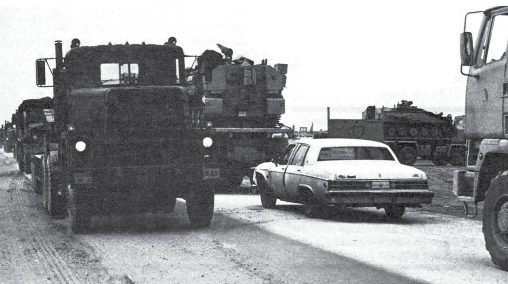 A battle-weary GM sedan makes its way up Tapline Road 