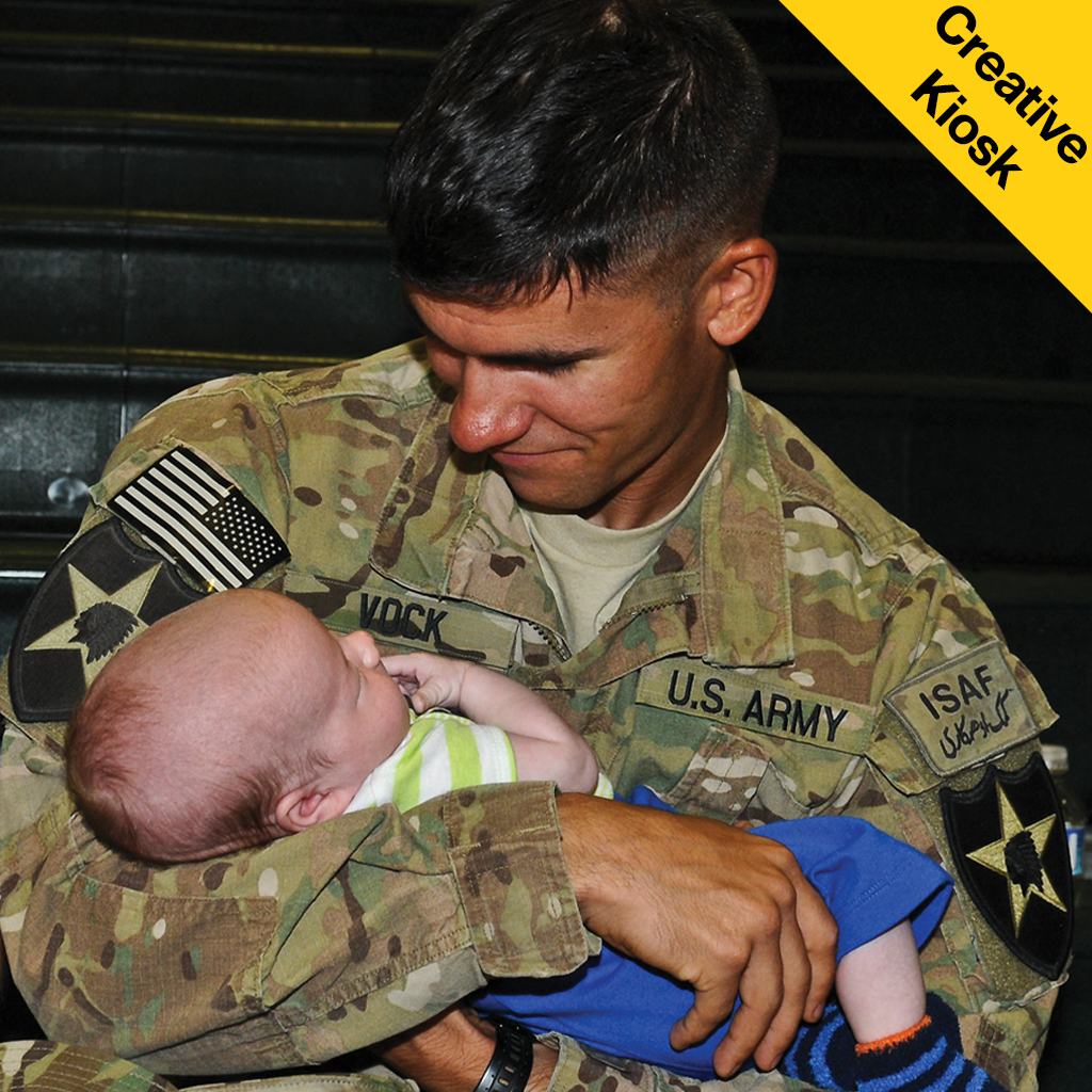 A Soldier holds his newborn son