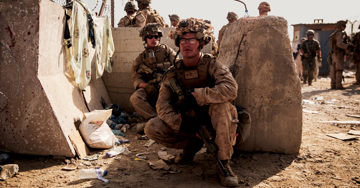 Marines take a moment to rest on 21 August 2021 during the evacuation at Hamid Karzai International Airport in Kabul, Afghanistan