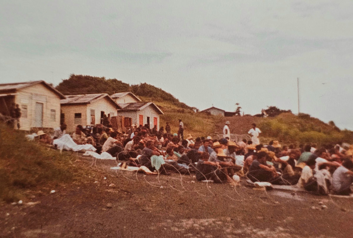 Prisoners of war await interrogation at a Point Salinas Estates compound on a hill overlooking the airfield in Grenada 1983