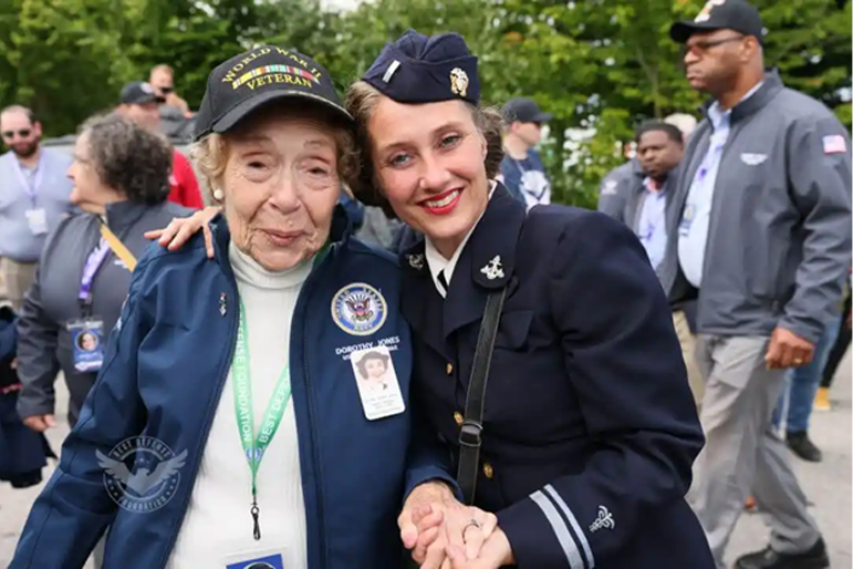 A World War II veteran is greeted with appreciation during her participation in activities honoring the 78th anniversary of D-Day held at Normandy, France.