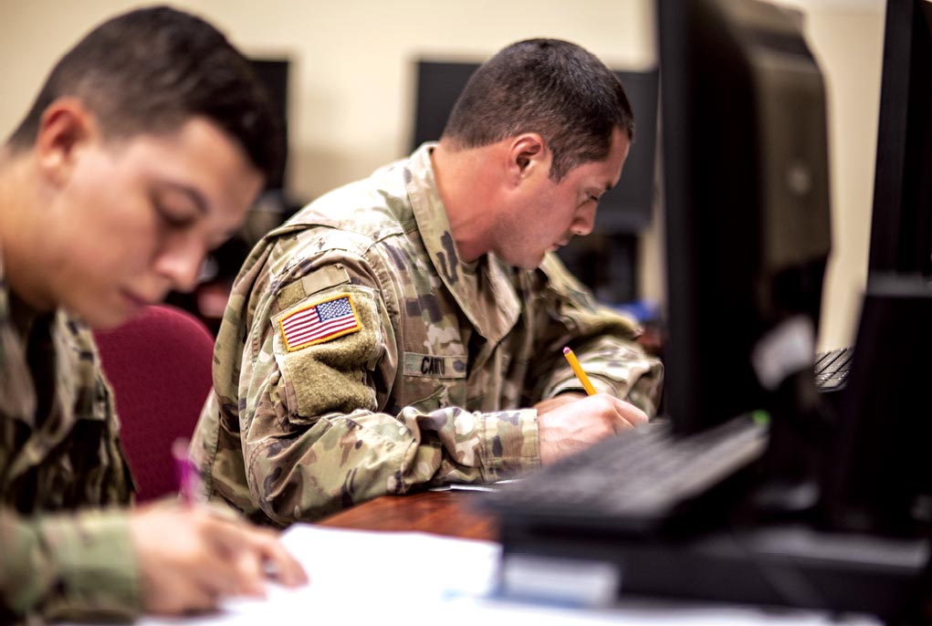 Soldiers take an exam 31 July 2018 at the Fort Knox Education Center at Fort Knox, Kentucky.