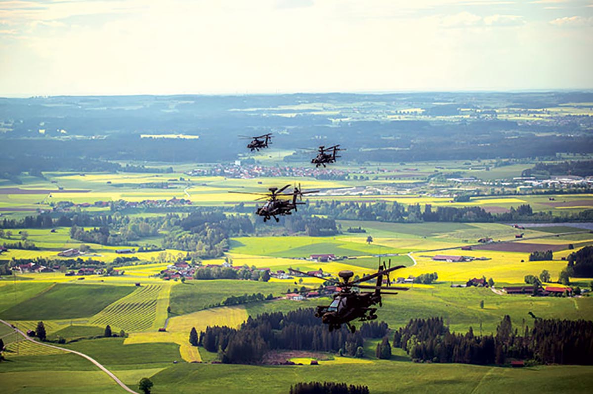 A formation of AH-64 Apache attack helicopters