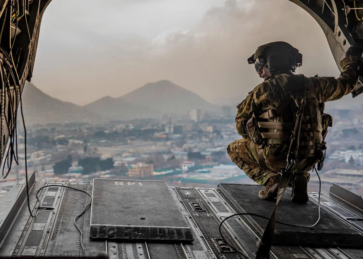A soldier from the back of a CH-47 Chinook
