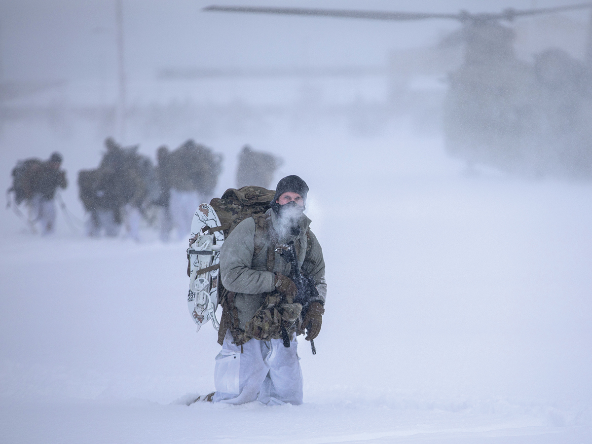 10th Mountain Division soldiers trek through the snow