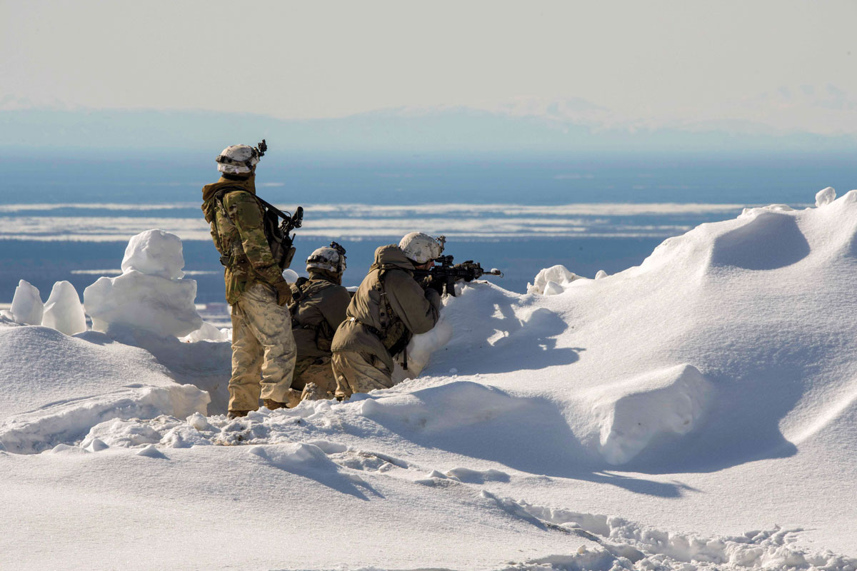Soldiers survey the surrounding area while acting as opposition forces during Joint Pacific Multinational Readiness Center-Alaska 23-02 at Yukon Training Area