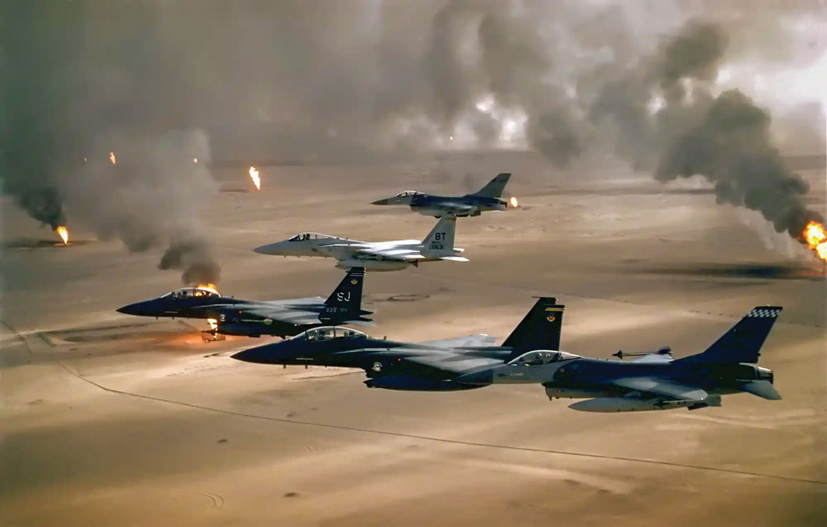 Air Force F-16, F-15C, and F-15E aircraft from the 4th Fighter Wing fly over Kuwaiti oil fires set by the retreating Iraqi army during Operation Desert Storm in 1991. The overwhelming defeat of the Iraqi forces validated U.S. Army AirLand Battle doctrine