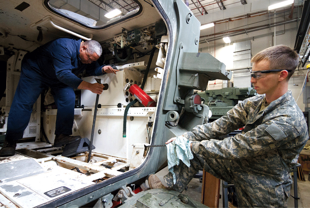 J. L. McDonald, a heavy equipment repairer with the Department of the Army, applies leverage with a pry bar 14 March 2017