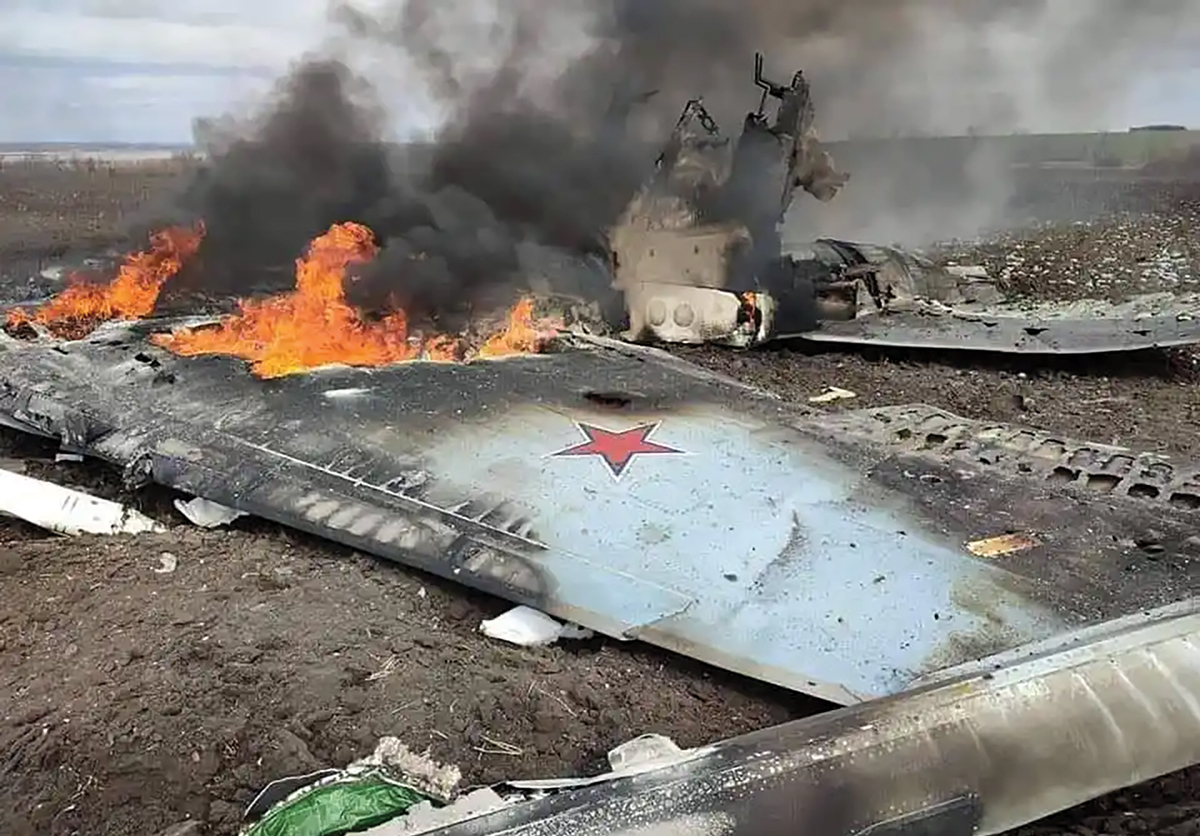 The wreckage of a Russian SU-35 fighter shot down by the Ukrainian Air Force burns on the ground in the Kharkiv region circa 3 April 2022