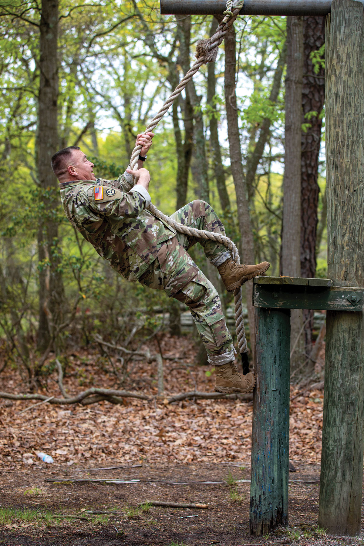 U.S. Army Reserve Command Sgt. Maj. Gregory G. Dirks, the command sergeant major of the 361st Theater Public Affairs Sustainment Element, climbs a rope on an obstacle course during Operation Strike Back at Joint Base McGuire-Dix-Lakehurst, New Jersey, 27 April 2023