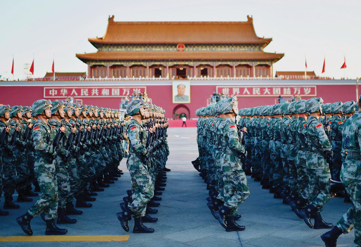 Chinese soldiers march past the six-centuries-old Tian’anmen Rostrum during a military parade on 3 September 2015 in Beijing to commemorate the seventieth anniversary of China’s victory against Japanese aggression