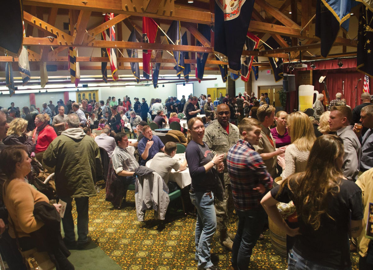U.S. service members and civilians attend the annual JBLM Brewfest at the Club at McChord Field 20 February 2015 on Joint Base Lewis-McChord, Washington