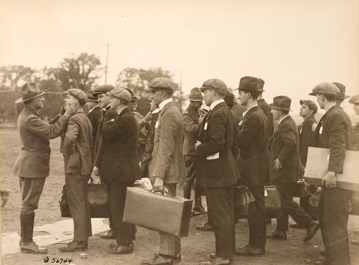 Dr. Yussuff examines draftees 21 January 1919 at Camp Devens, Massachusetts