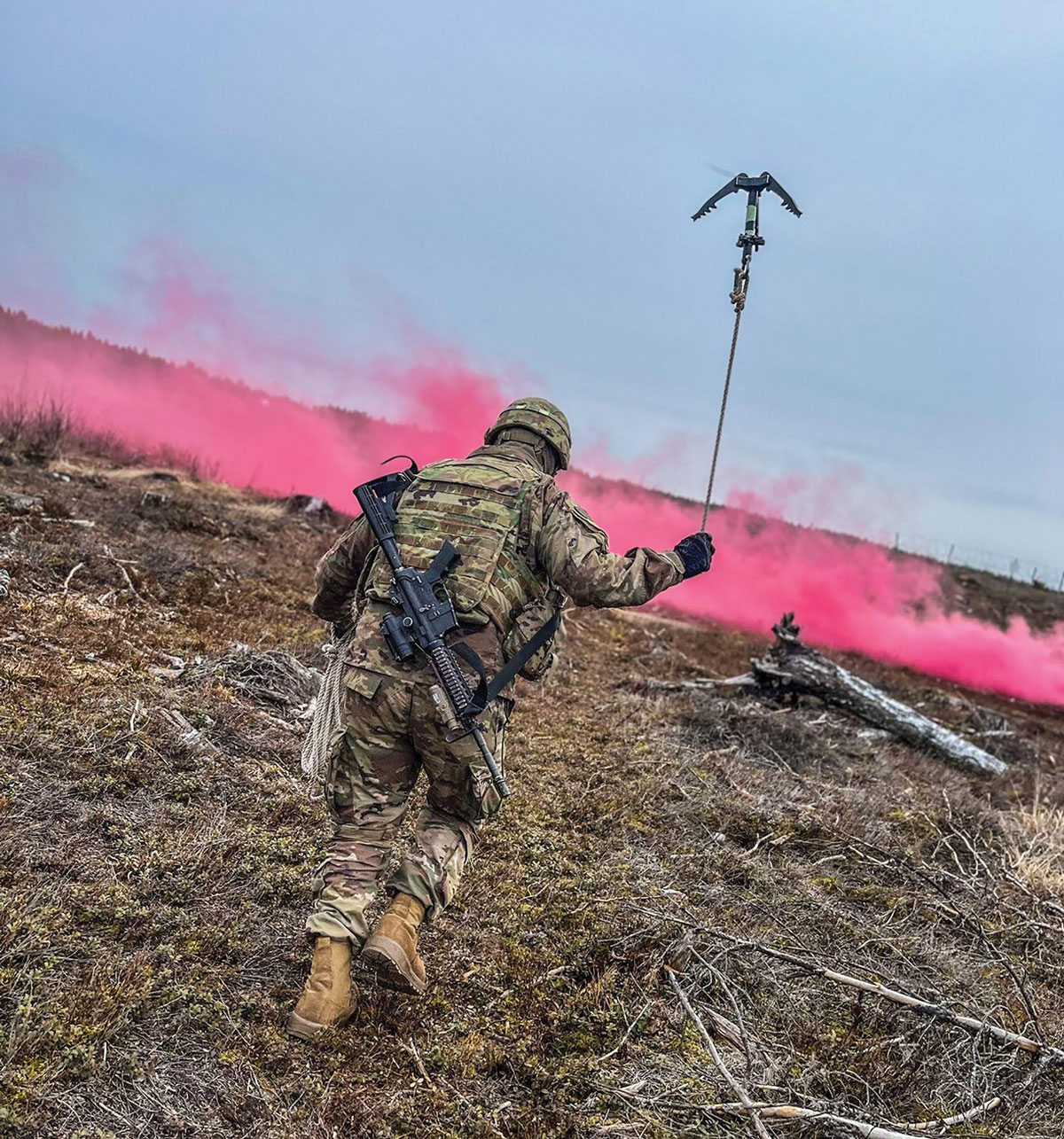 A TF Mustang sapper from Company A, 8th Brigade Engineer Battalion, 2nd Armored Brigade Combat Team, 1st Cavalry Division, uses a grappling hook