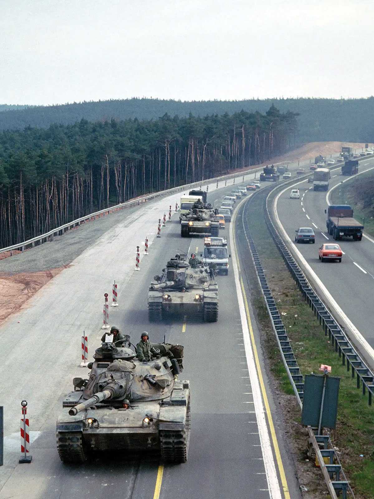 A column of 3rd Armored Division M60A3 tanks